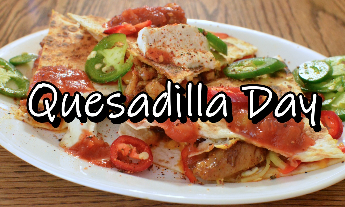 Chicken quesadilla with peppers, salsa, and sour cream, with the words Quesadilla Day